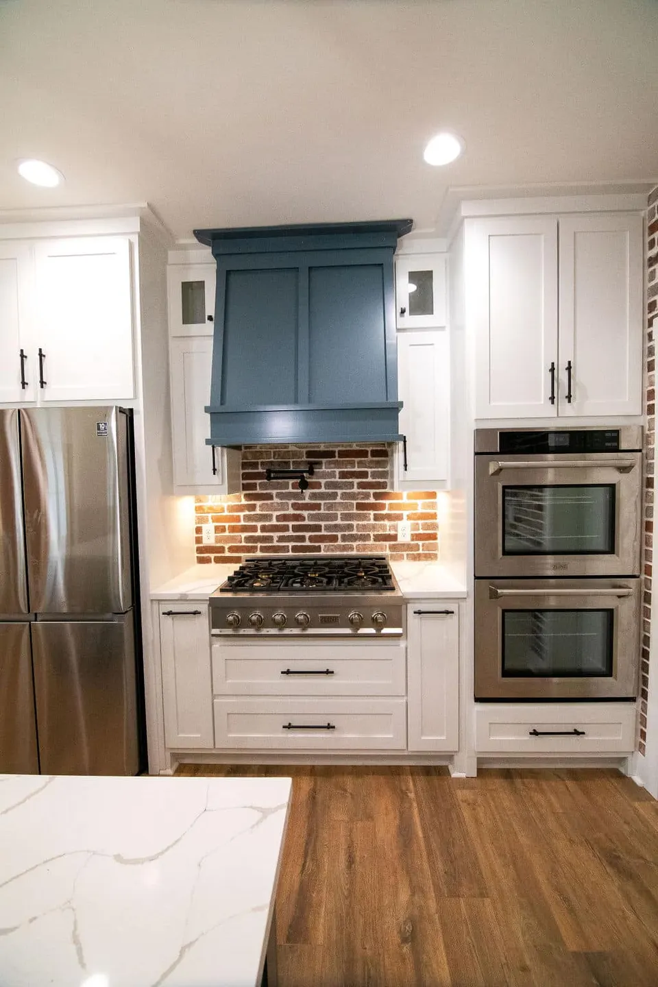 Brick range wall and custom kitchen